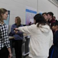 group of people around a project